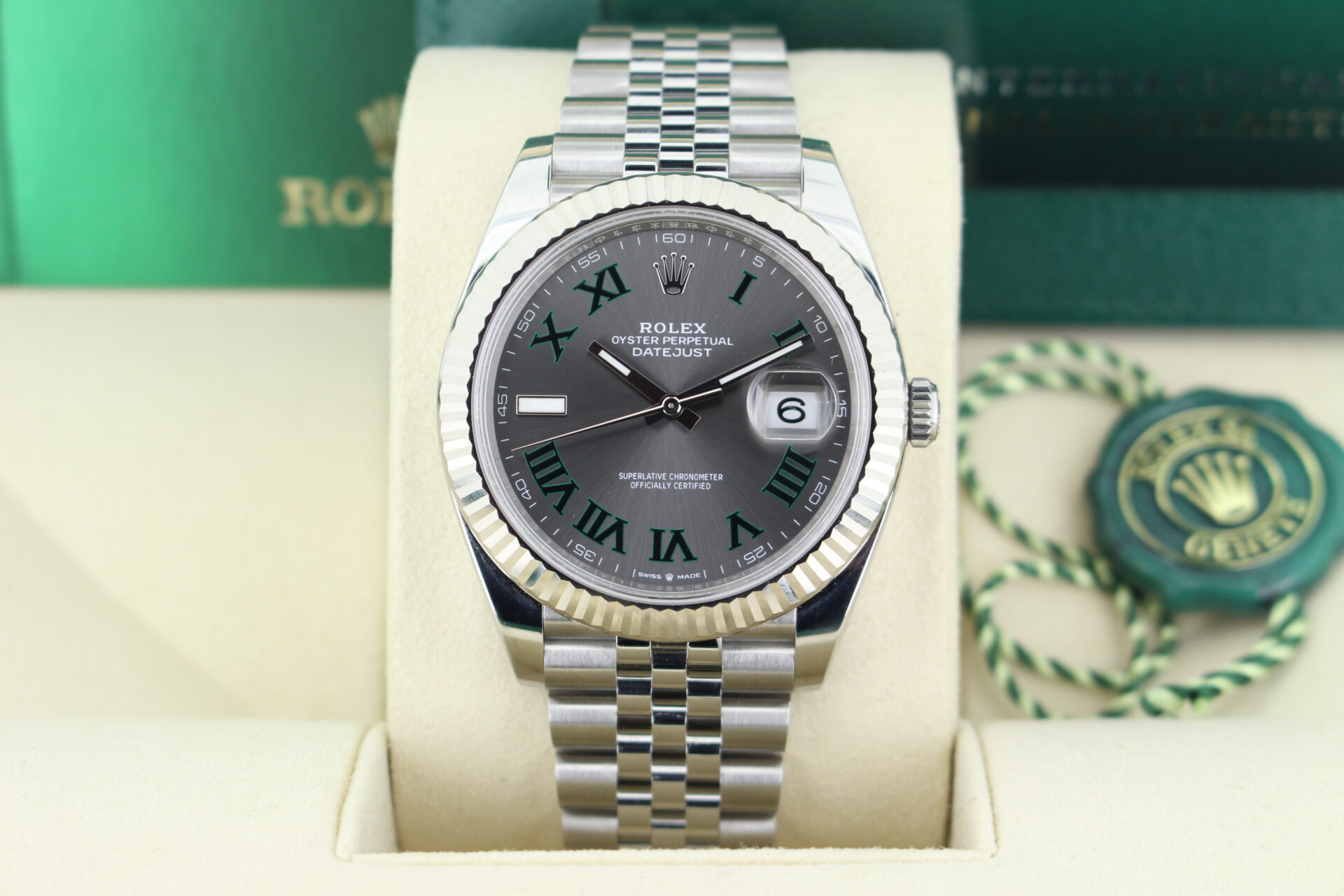 Close up of Rolex Datejust 41 Wimbledon 126334 in it's box with green swing tag, booklets and warranty card