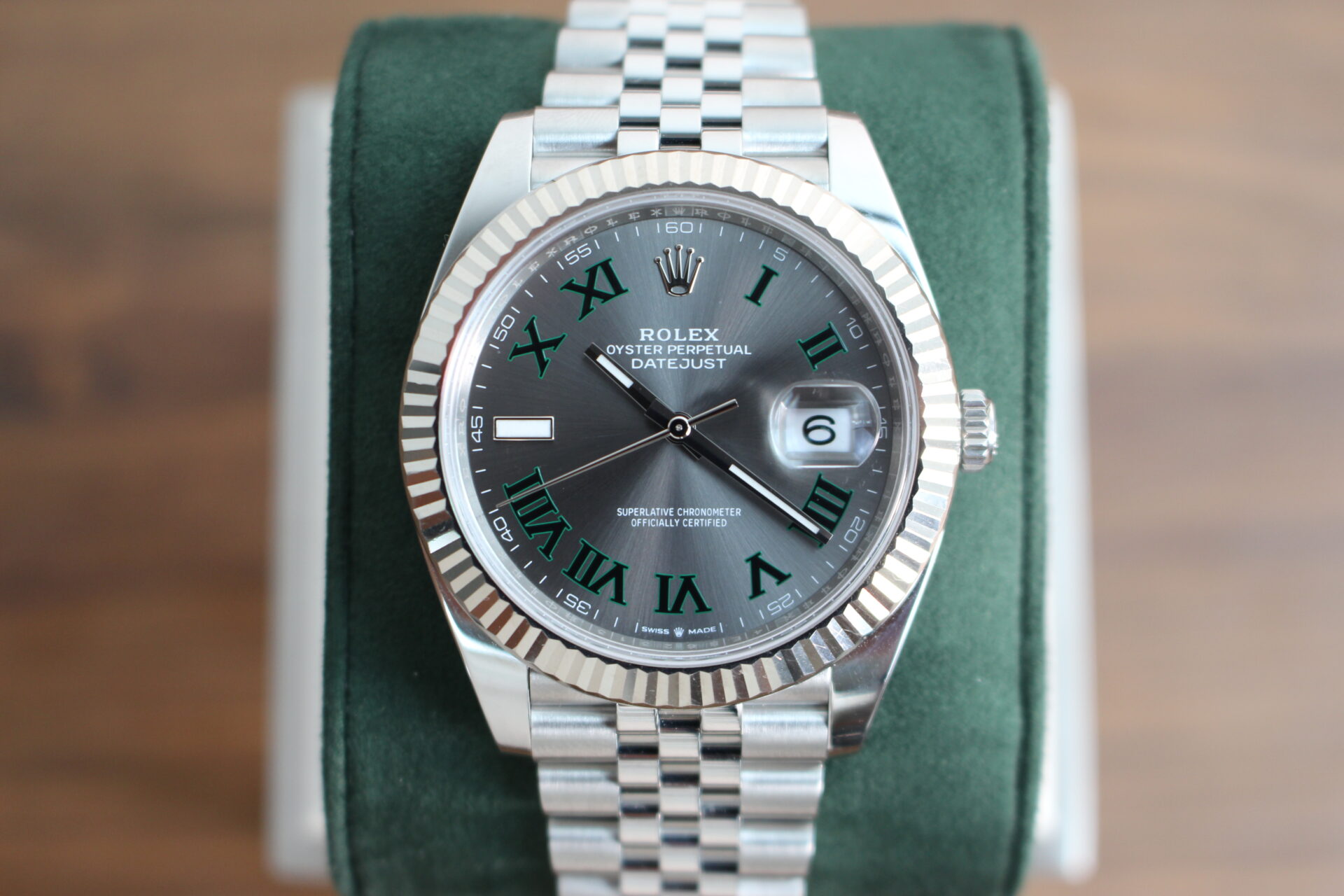 Rolex Datejust 41 Wimbledon on a green watch cushion