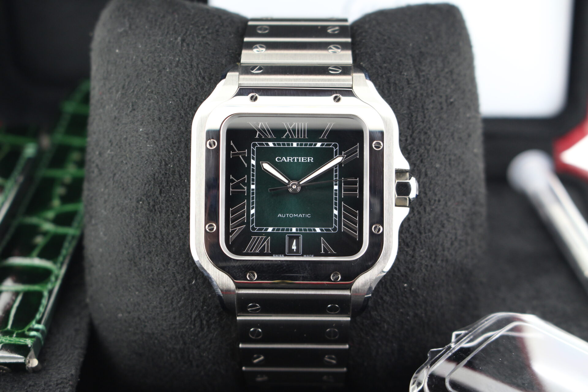 Close up of Cartier De Santos Green Large in it's box with bezel protector, strap changing tool, green leather interchangeable strap