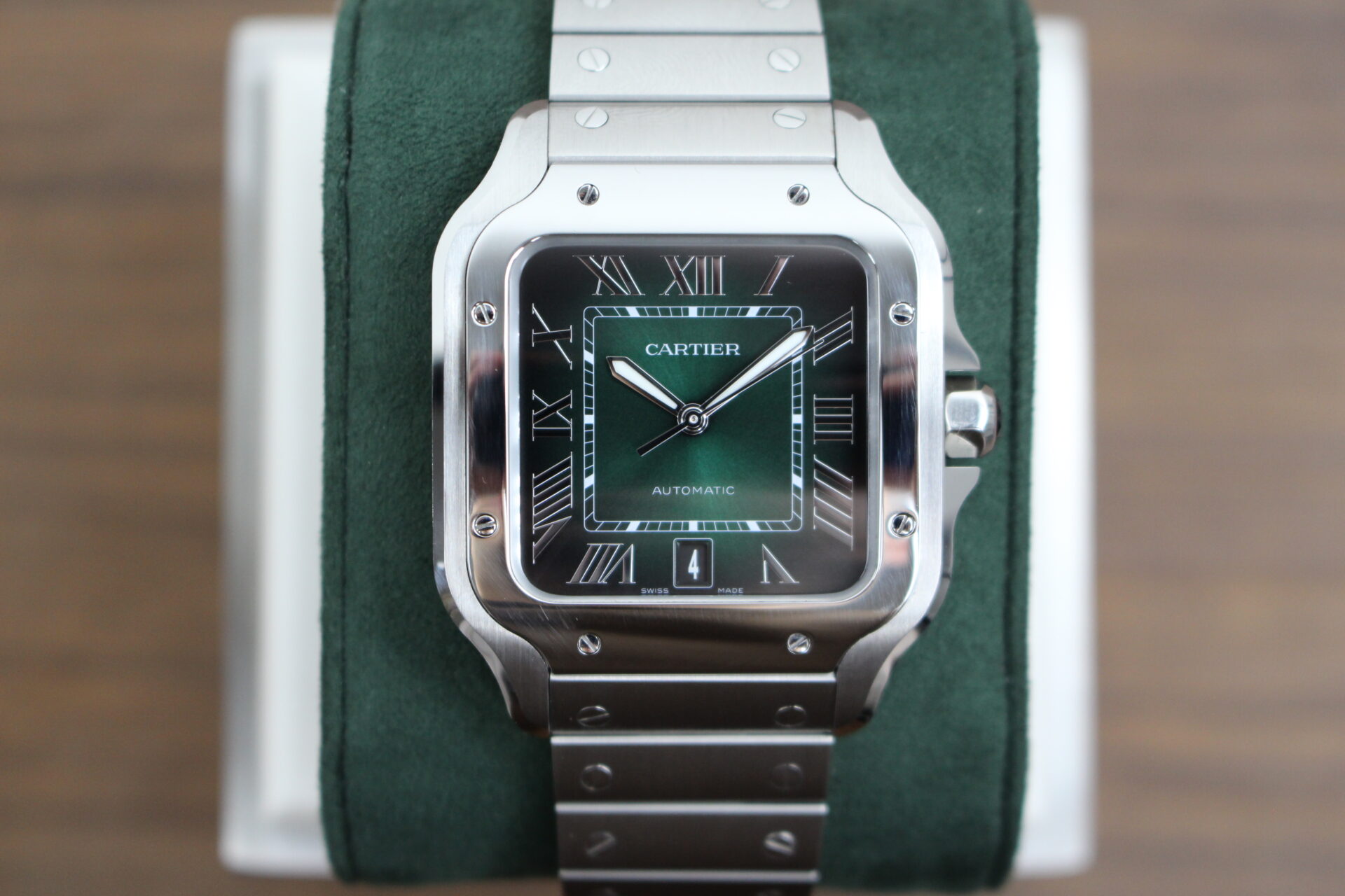 Cartier De Santos Green Large on a green cushion