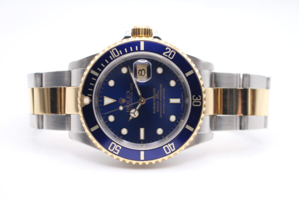 Rolex Submariner Bluesy posed on its side with white background