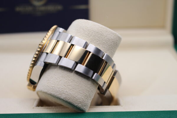 Rolex bi-metal oyster bracelet attached to a Submariner