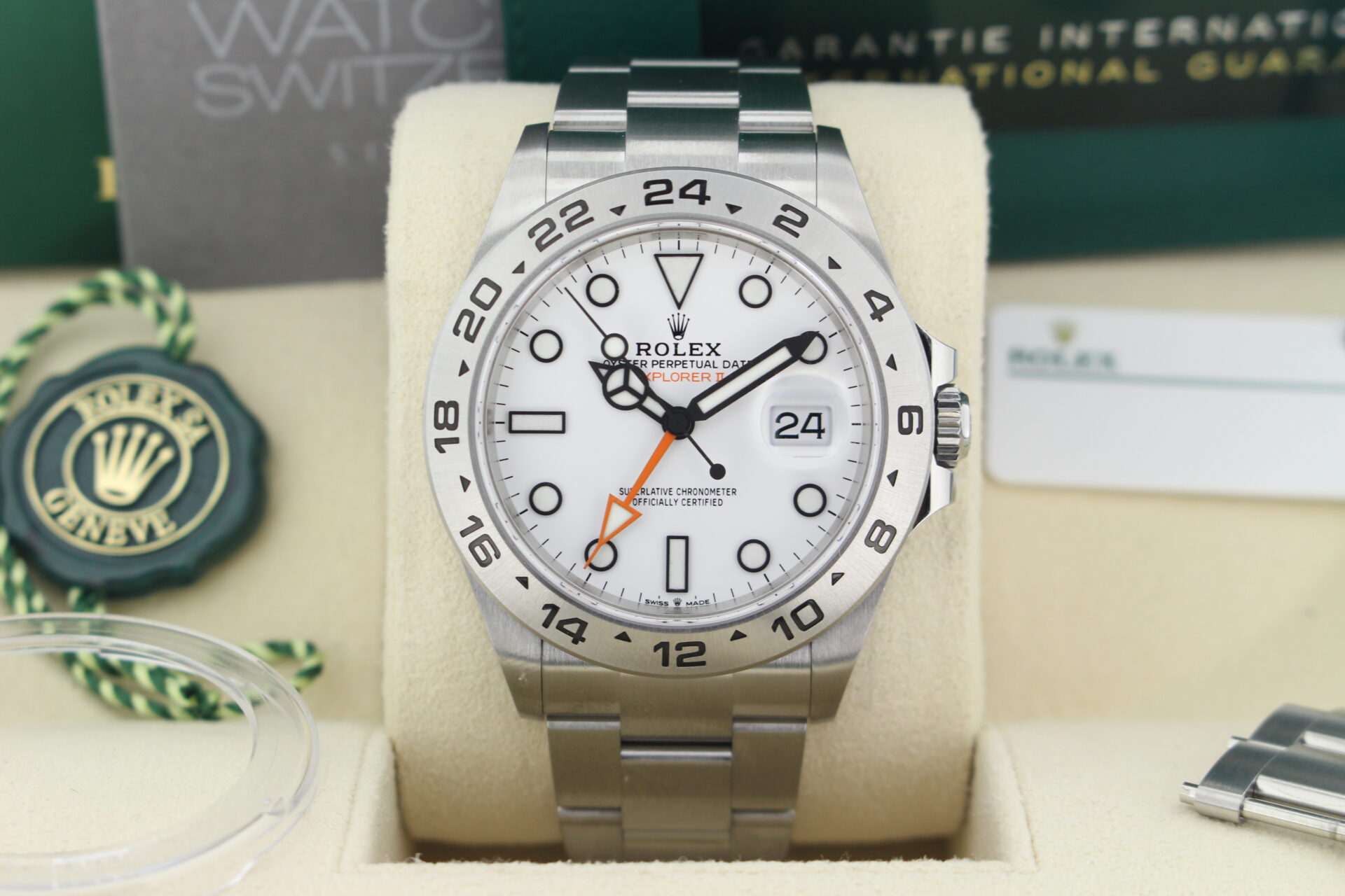 Close up of Rolex Explorer II Polar 226570 in it's box with both swing tags, booklets, original purchase receipt and warranty card