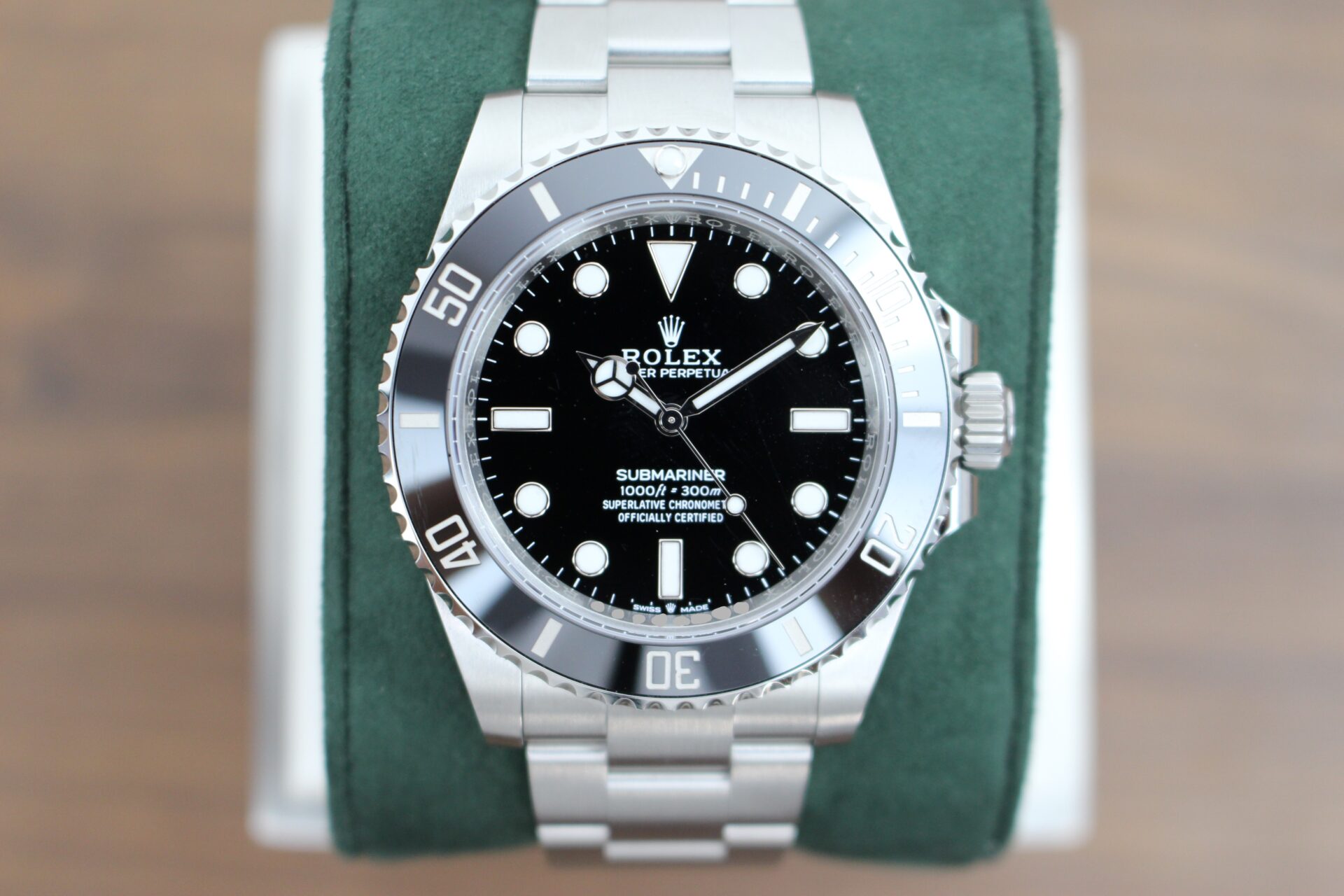 Rolex Submariner No Date 124060 on a green cushion