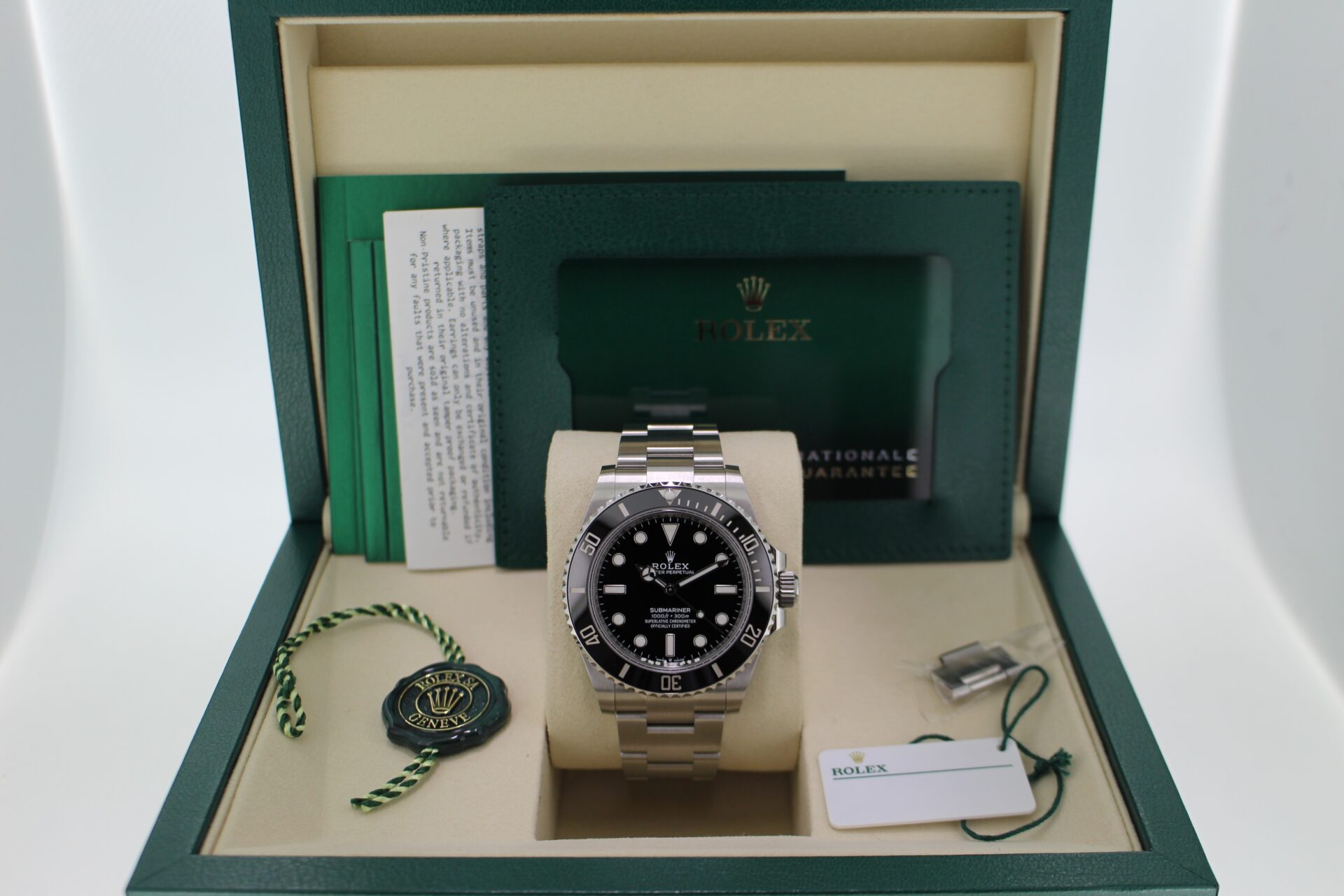 Rolex Submariner No Date 124060 in its box with both swing tags, booklets, original purchase receipt and warranty card