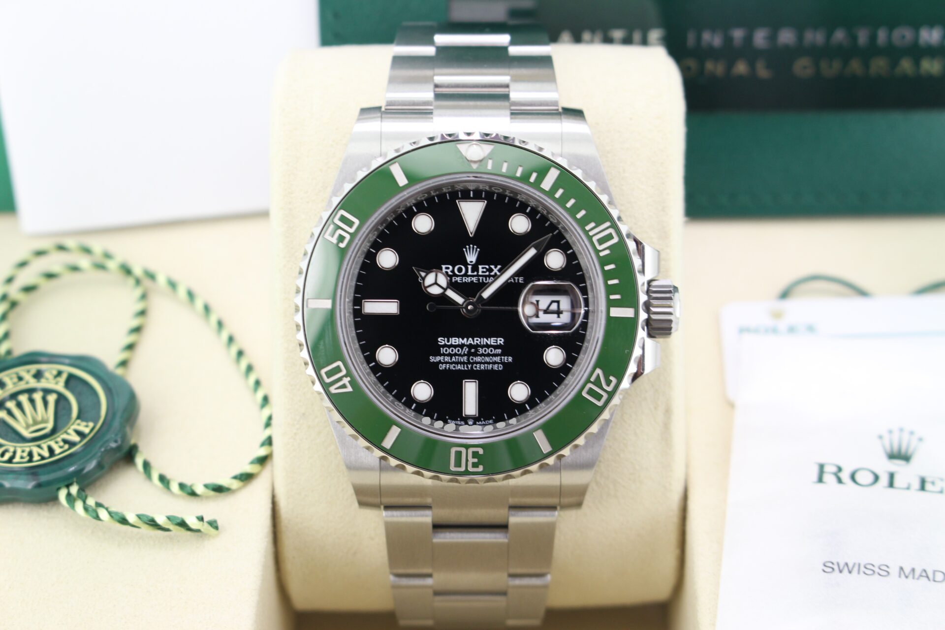Close up of Rolex Submariner Starbucks 41mm 126610LV in it's box with both swing tags, booklets, original purchase receipt and warranty card