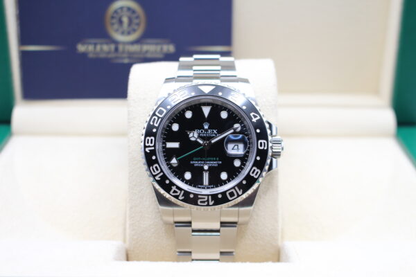 Rolex GMT Master in its box sat upright on cushion