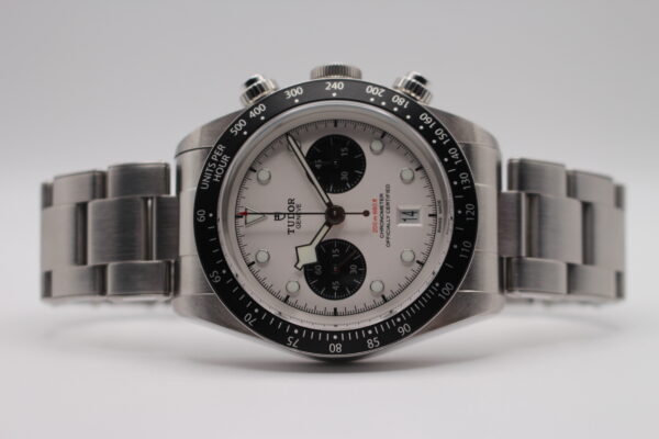 Tudor Black Bay Chrono White Dial laid on its side on a white background