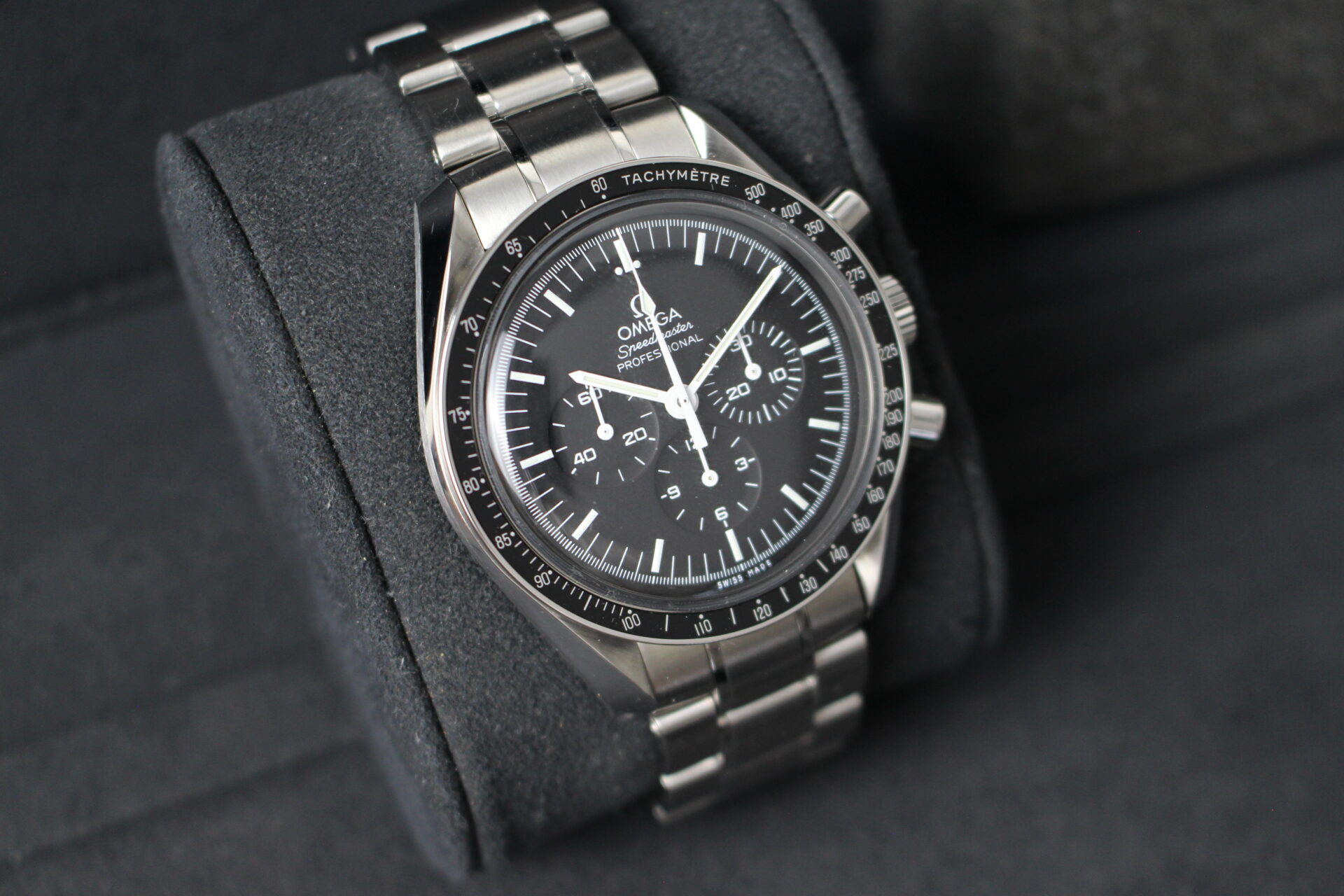 Omega Speedmaster Moonwatch Professional facing towards the right to show the left angle