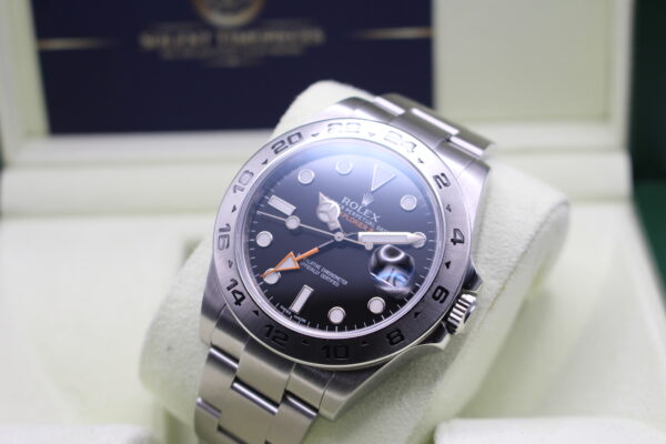 Rolex Explorer II laid back at an angle with light reflecting of the dial