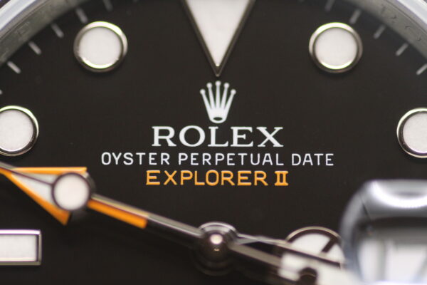 Rolex Oyster Perpetual Date Explorer II written on black dial