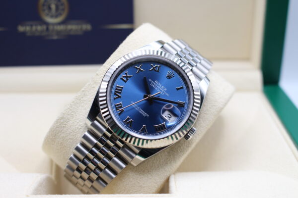 Rolex Azzurro Dial Datejust 41mm on a jubilee bracelet. Light shining on the dial. Laid back at an angle