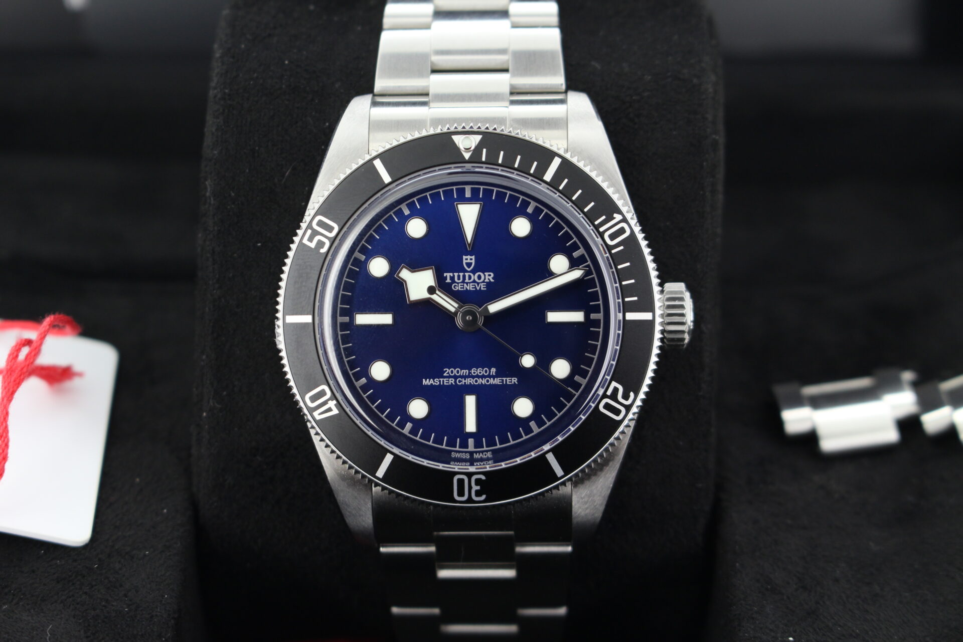 Close up of Tudor Black Bay 68 7943A1A0NU in it's box with swing tag, booklets and warranty card