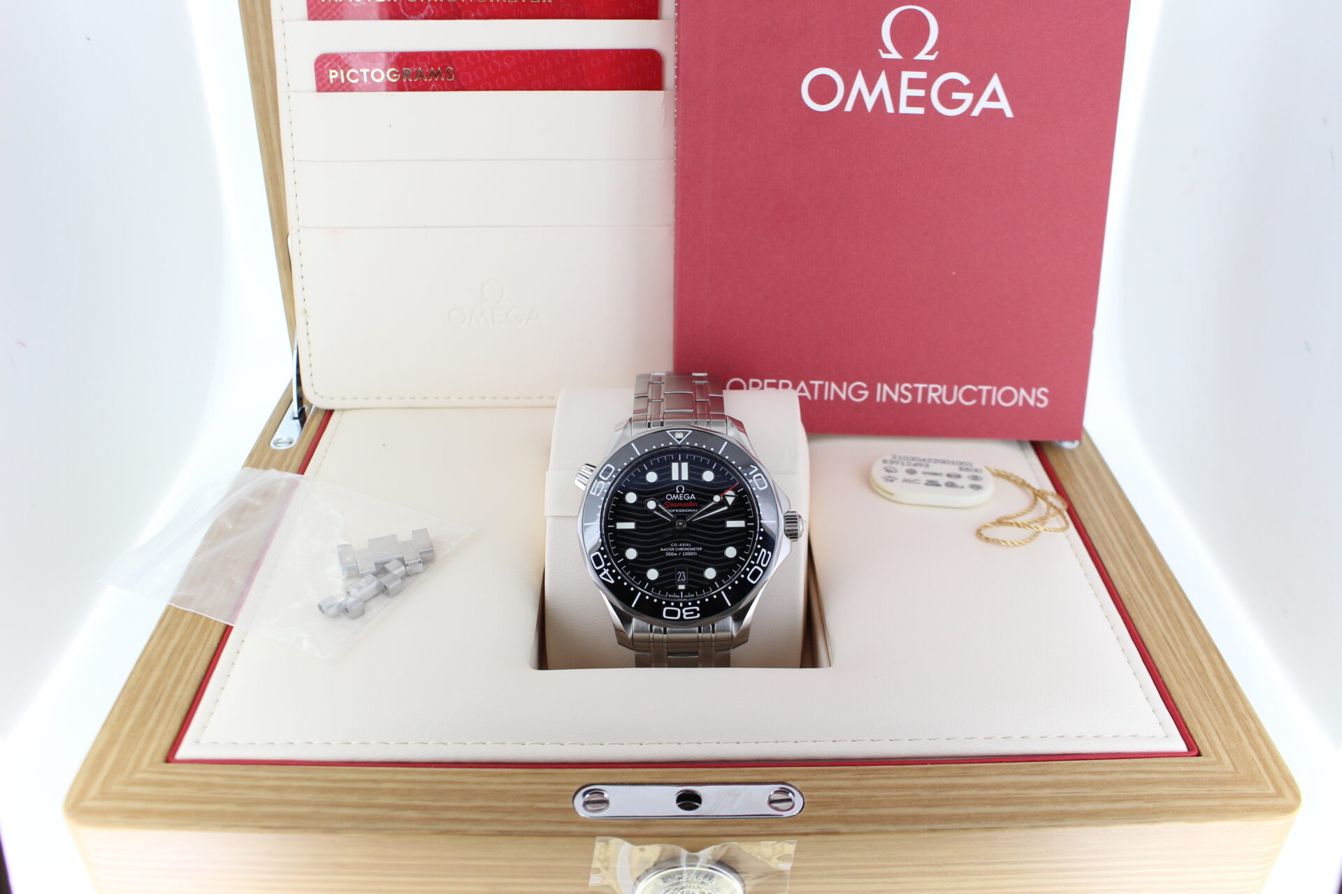 Omega Seamaster Diver Black 300m in it's box with swing tag, booklet and warranty cards
