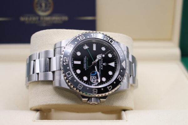 Rolex GMT Master II laid on its side crown facing down
