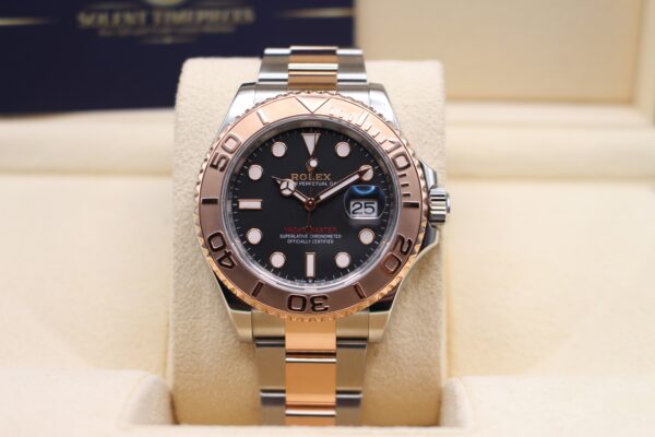 Rolex YM40 Rose Gold with a black dial reading 10 past 10