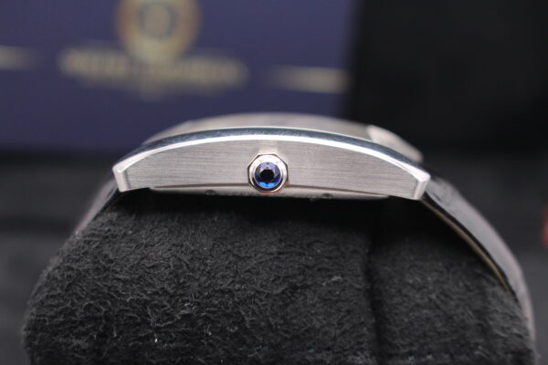 Cartier Tank MC showing blue sapphire in crown