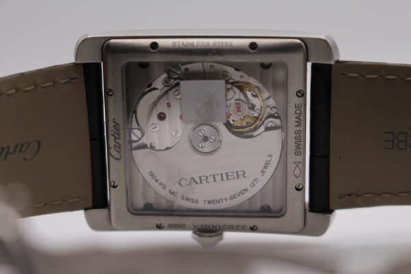 Cartier Tank MC view of inside case through glass, showing movements