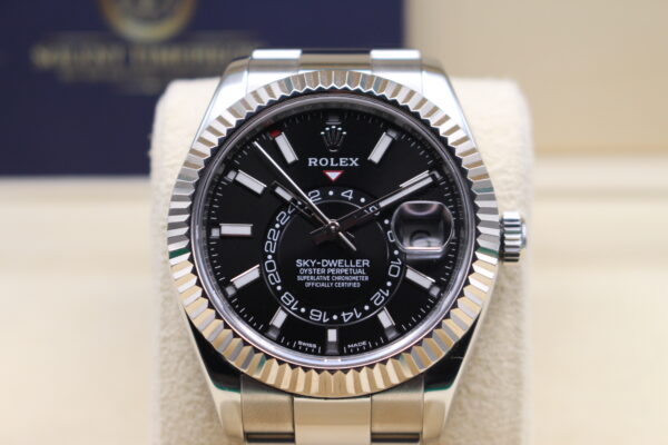 Rolex Sky-Dweller 326934 showing 10:10 on a black dial and fluted bezel