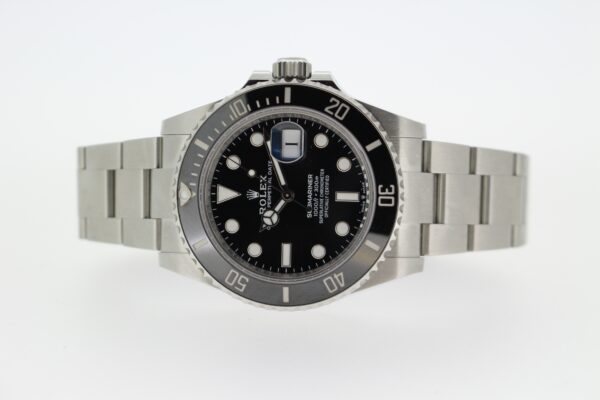 Rolex Submariner 41mm laid down on a white background