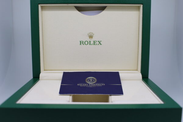 Rolex box open with a solent timepieces business card