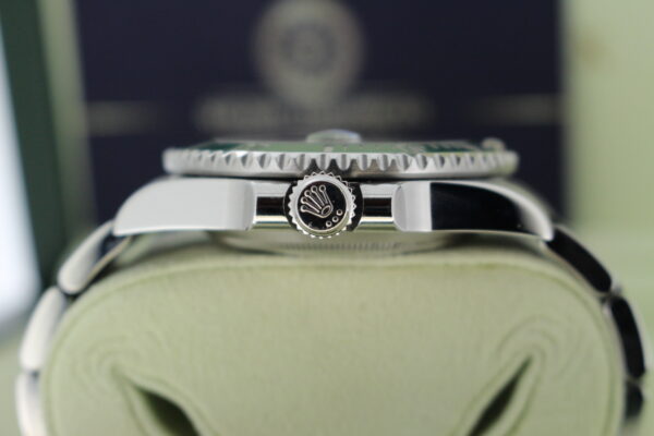 Rolex Hulk 116610LV showing the crow and side of watch