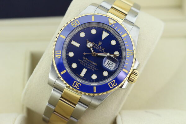 Rolex Submariner Bluesy sat on its watch cushion slightly leaned back