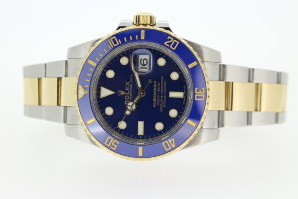 Rolex Submariner Bluesy 116613lb on its side on a white background