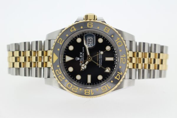 Rolex GMT Master II Zombie on its side on a white background