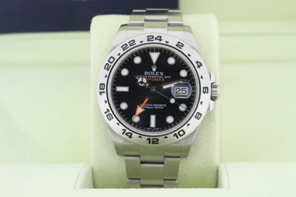 Rolex Explorer II Watch with a black dial and orange GMT Hand