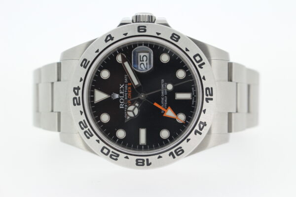 Rolex Explorer II on a white background contrasting the dial