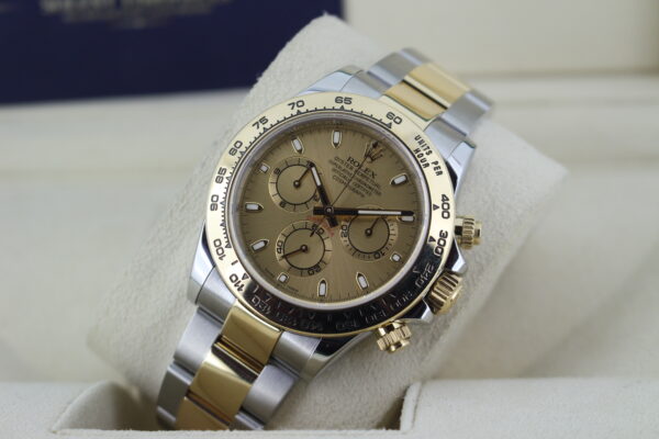 Rolex Daytona on its watch cushion leaned back with light reflecting on its dial
