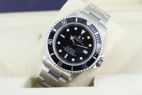 Rolex Vintage Sea Dweller on a watch cushion leaned on its side