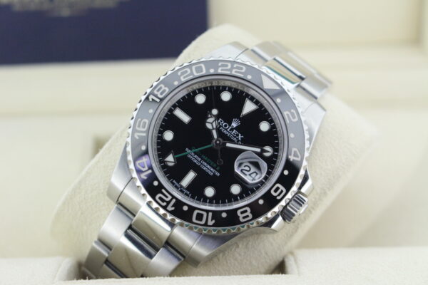Rolex GMT Master II on its watch cushion leaned back