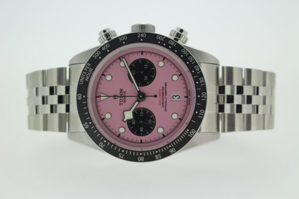 Tudor inter Miami pink laid on its side on a white background