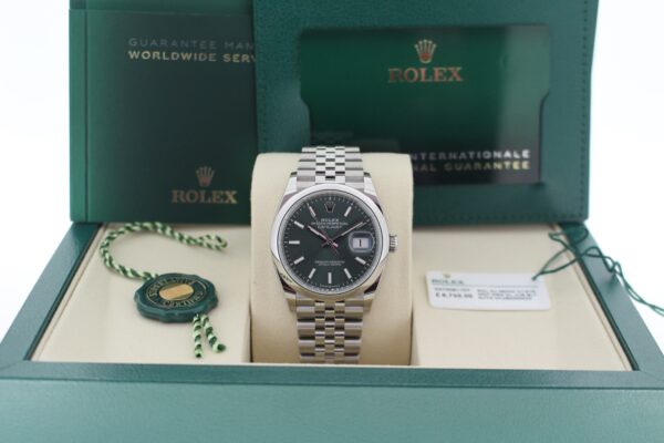 Rolex Datejust 126200 in it's box with booklets, card, both tags