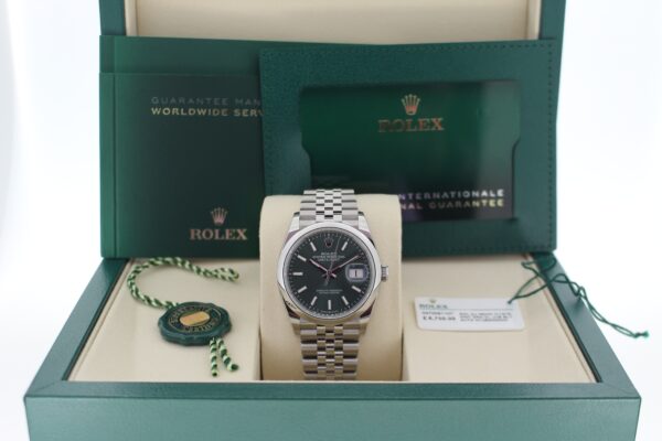 Rolex Datejust 126200 in it's box with booklets, card, both tags