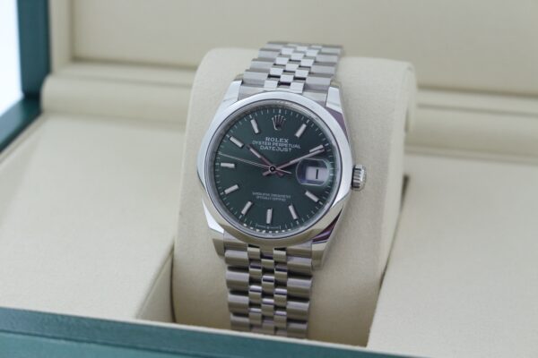 Rolex Datejust 126200 facing towards the left, showing the right side