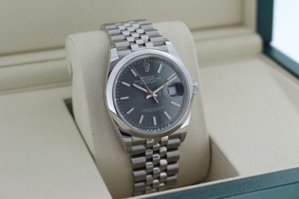 Rolex Datejust 126200 facing towards the right, showing the left side