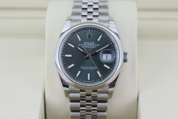 Rolex Datejust 126200 with green dial in it's box