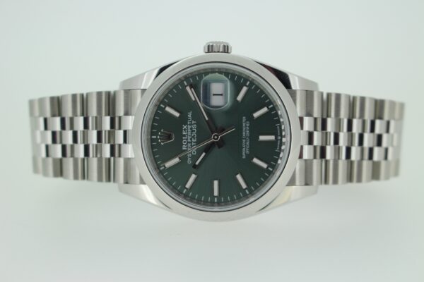 Rolex Datejust 126200 with green dial on white background