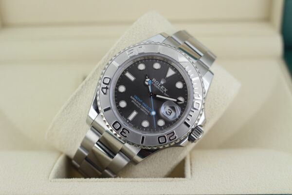 Rolex YM40 displayed at an angle with light reflecting on the platinum bezel