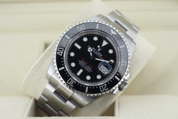 Rolex SD 43mm leaned at an angle with light reflecting on the dial
