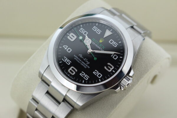 Rolex Air King displayed at an angle with light reflecting on the bezel and dial