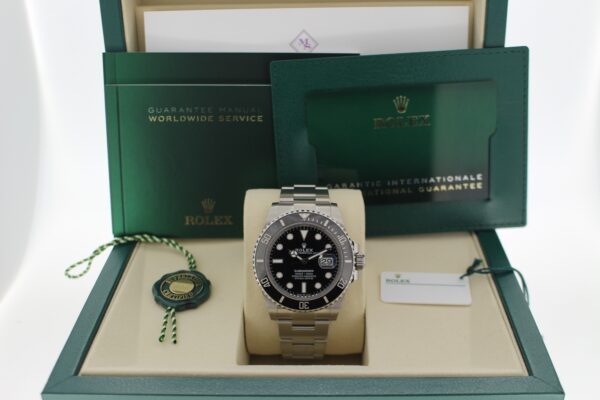 Rolex Submariner Date with its original purchase receipt and all original accessories making a full set