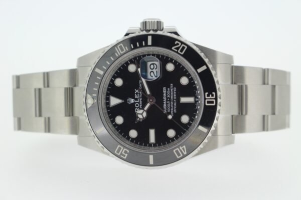 Rolex Submariner date laid down on a white background