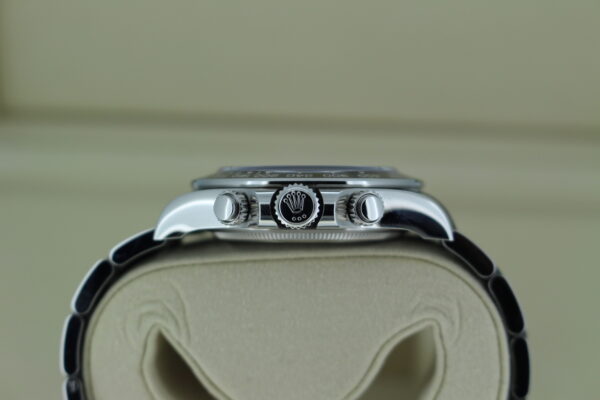 Rolex Daytona 'Panda' 126500 in it's box showing the the croowb with the Rolex logo and two pushers.