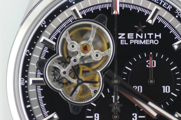 Close up of the open dial on a zenith el primero looking through into the movement