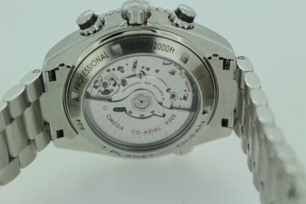 Omega sapphire caseback with a sapphire glass showing the movement