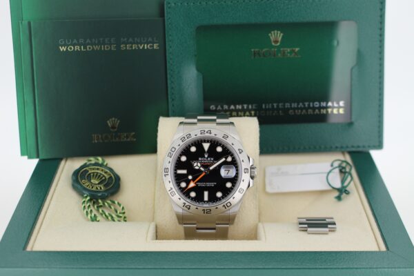 Rolex Explorer II 226570 in its box with booklets, warranty card, both swing tags and spare link